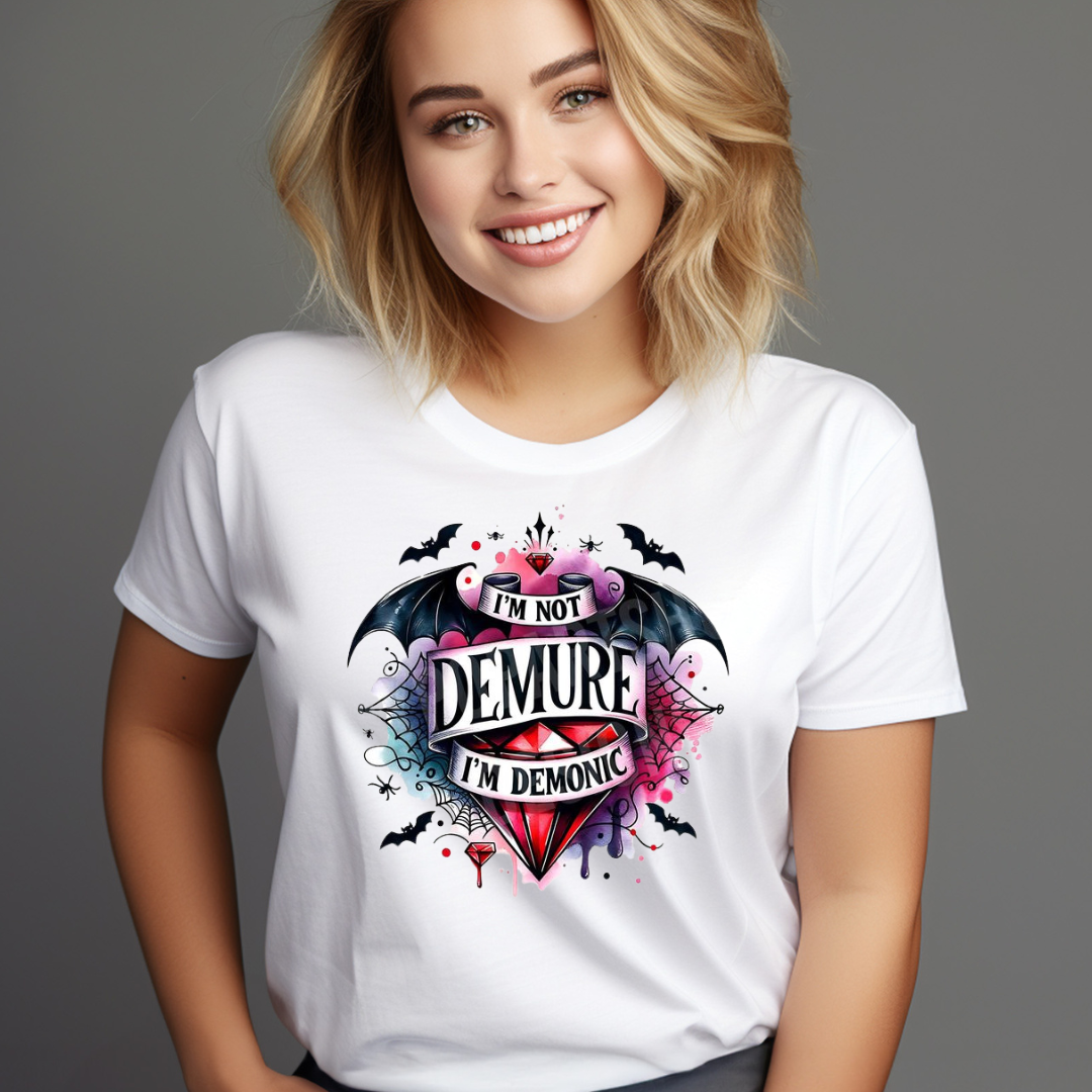 White funny demonic graphic tee with colorful demonic heart design worn by smiling woman