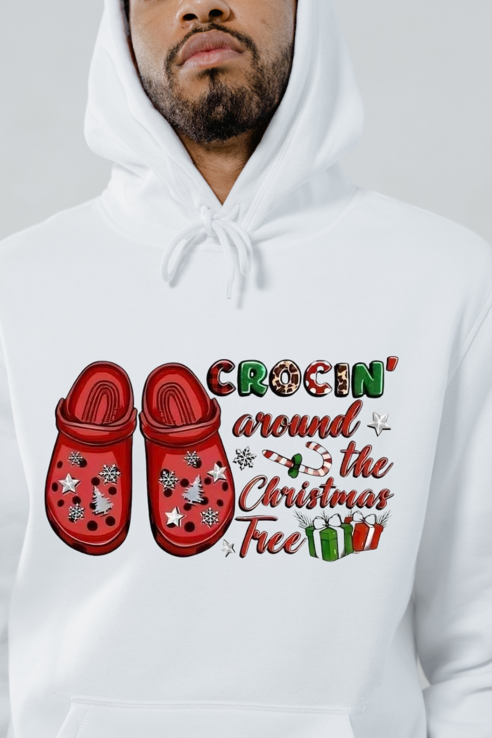 White holiday croc hoodie featuring red Crocs and festive Christmas text design