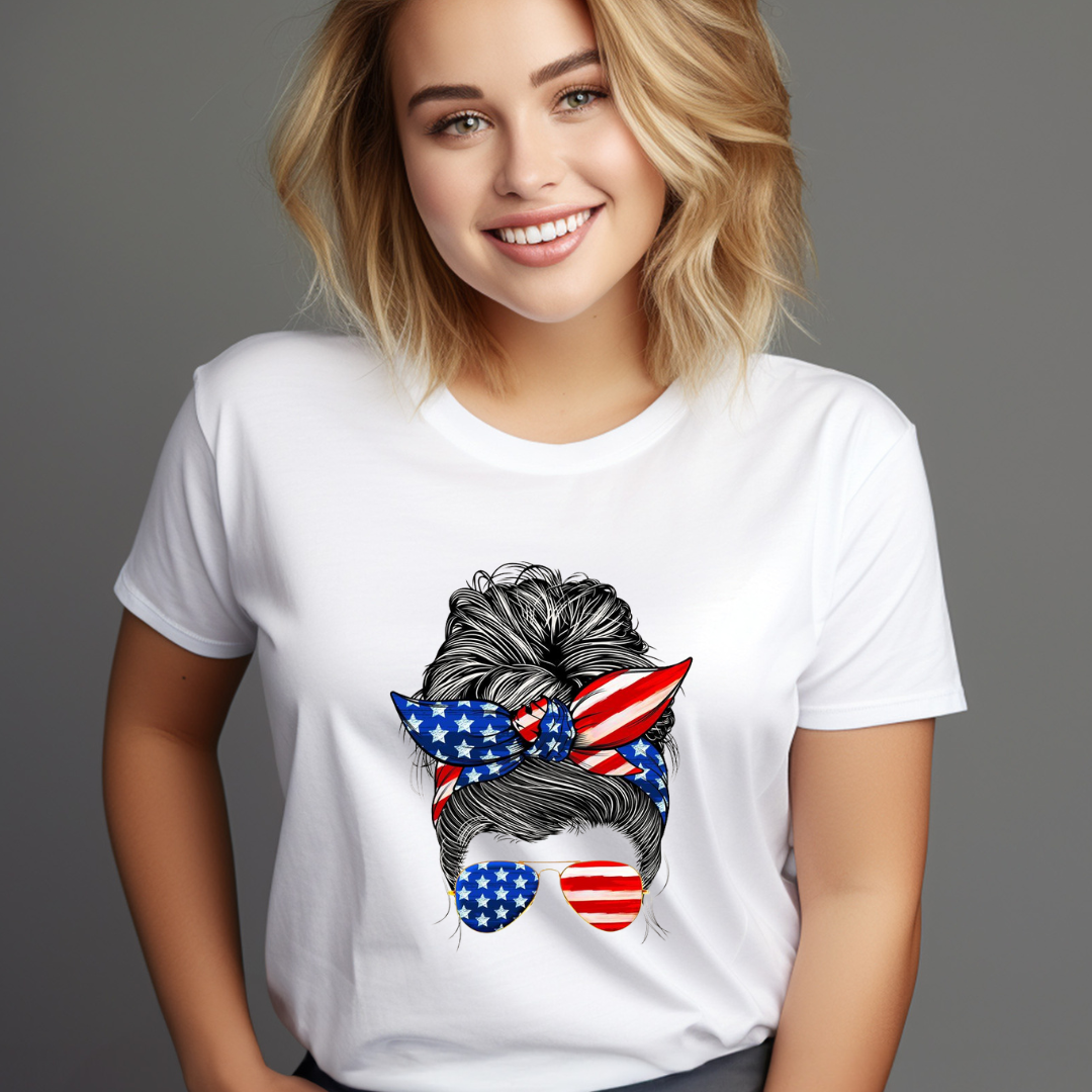 Smiling woman wearing a white American flag hair bun tee with stars and stripes design on bow and sunglasses