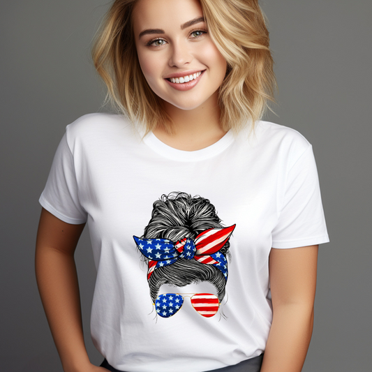Smiling woman wearing a white American flag hair bun tee with stars and stripes design on bow and sunglasses