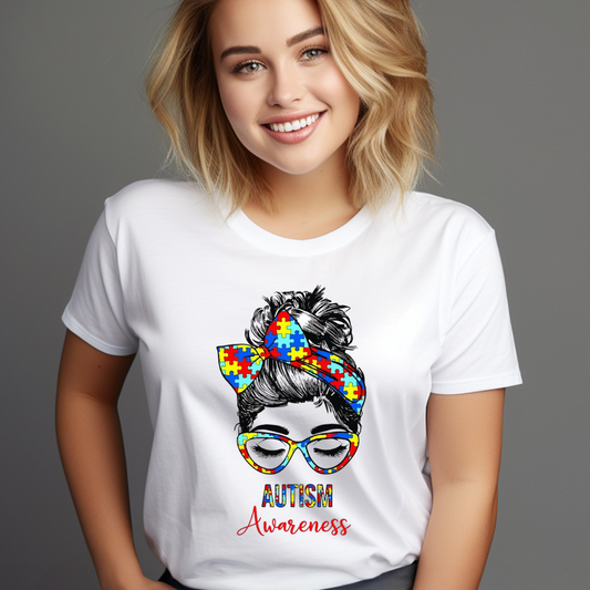 Woman wearing autism awareness messy bun shirt with puzzle piece design and colorful glasses