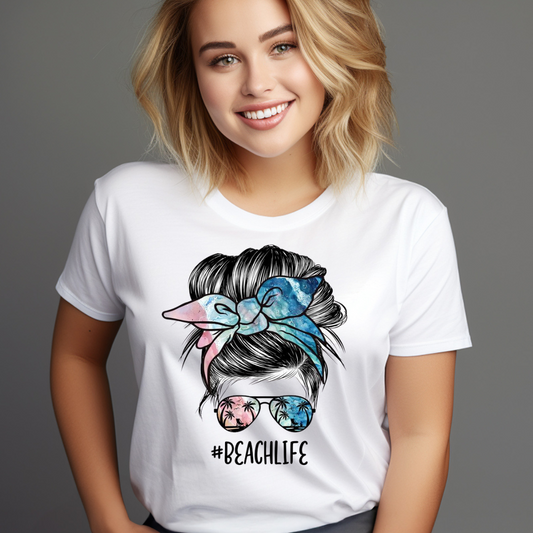 Smiling woman wearing a white Casual Beach Hair T-Shirt with a colorful hair bow and sunglasses graphic