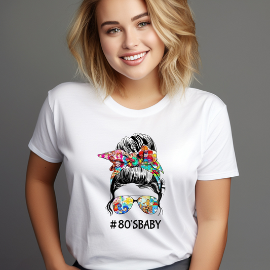 Smiling woman wearing a white 80s baby t-shirt with colorful hair scarf and sunglasses graphic