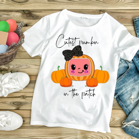 White t-shirt with cute pumpkin design and text Cutest pumpkin in the patch, cute Halloween shirts
