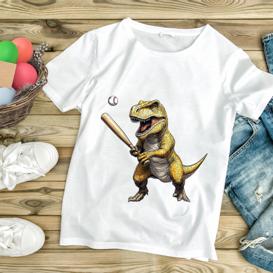 White dinosaur baseball t-shirt featuring a T-Rex holding a baseball bat and ball on a wooden background