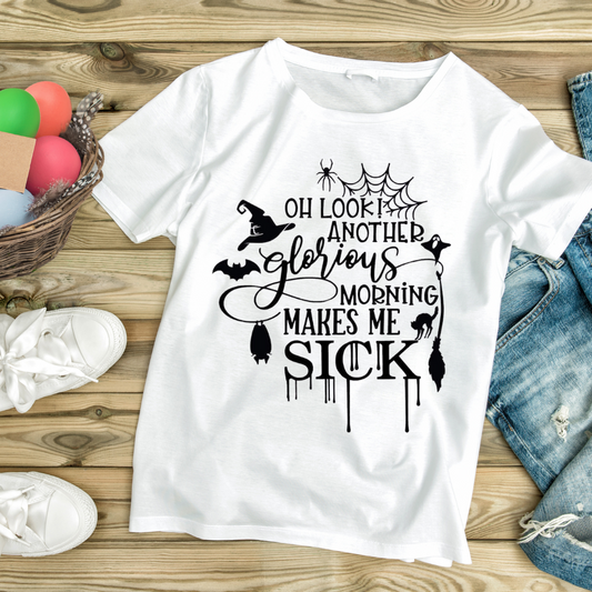 White funny morning t-shirt with Halloween themed text and graphics laid on wooden surface