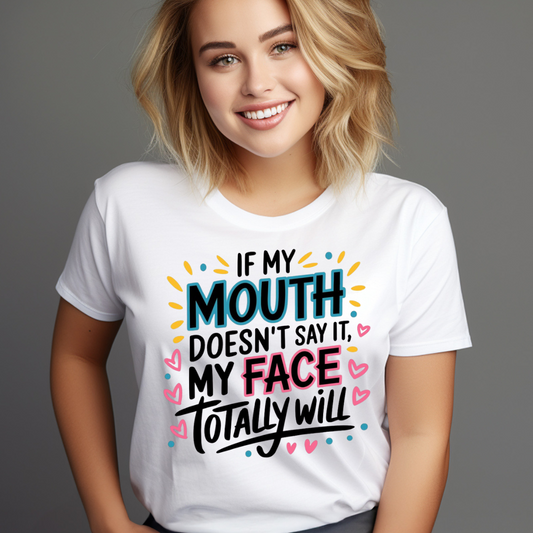 Smiling woman wearing a white graphic tees with quotes saying If my mouth doesn’t say it my face totally will