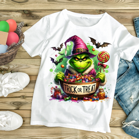 White t-shirt with Grinch in witch hat holding a bowl of candy and lollipop Halloween design unique Halloween gift idea