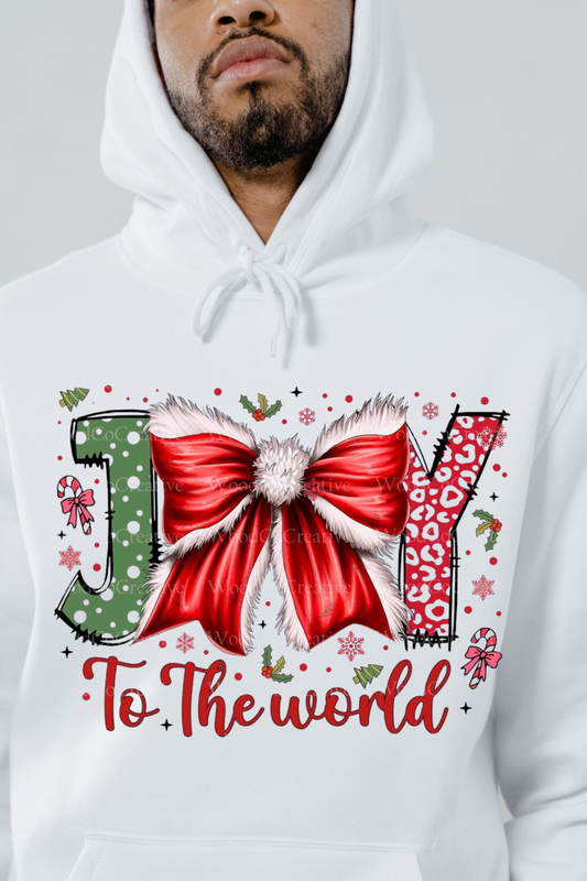 White hoodie featuring joy to the world sweatshirt design with holiday-themed lettering and red bow
