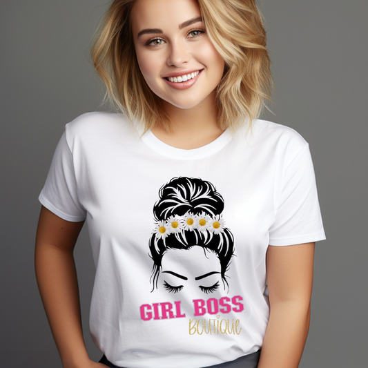 Woman wearing a white Messy Bun Girl Boss T-Shirt with a floral hair bun design and pink text