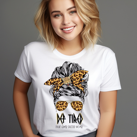 Woman wearing a white Messy Bun T-Shirt Def Tired with leopard print bow and sunglasses graphic