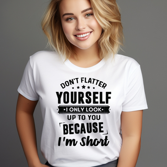 Smiling woman wearing a white novelty tee for short people with a humorous printed message