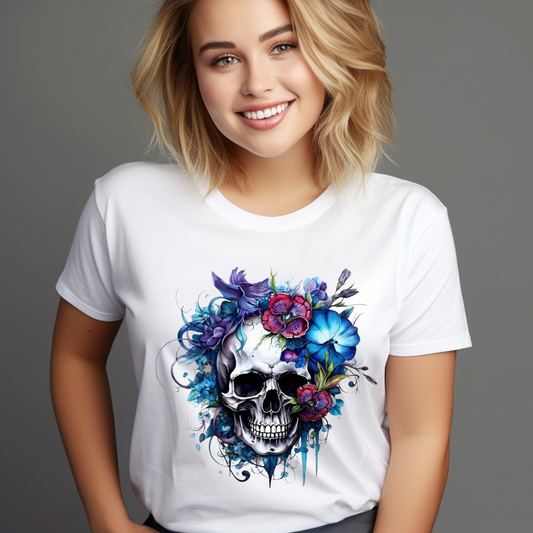 White skull graphic tee with colorful floral design worn by smiling woman