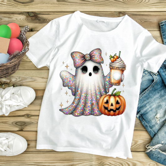 White t-shirt with cute glittery ghost holding a pumpkin spice drink and carved pumpkin design