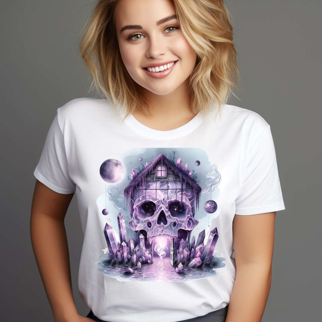 White t-shirt featuring unique skull house decor design with purple crystals and full moon