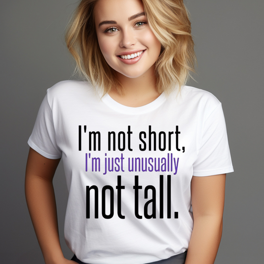 Woman wearing a unique height humor shirt with the text I'm not short I'm just unusually not tall
