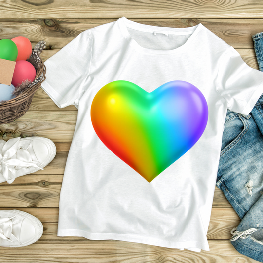 White t-shirt featuring a vibrant 3D rainbow heart shirt design displayed on a wooden surface