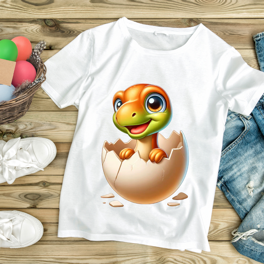 White dinosaur egg hatching tee with colorful baby dinosaur illustration by customizable creations