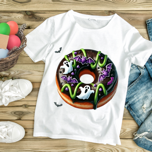 White t-shirt with a green donut Halloween shirt design featuring ghosts and bats by Customizable Creations