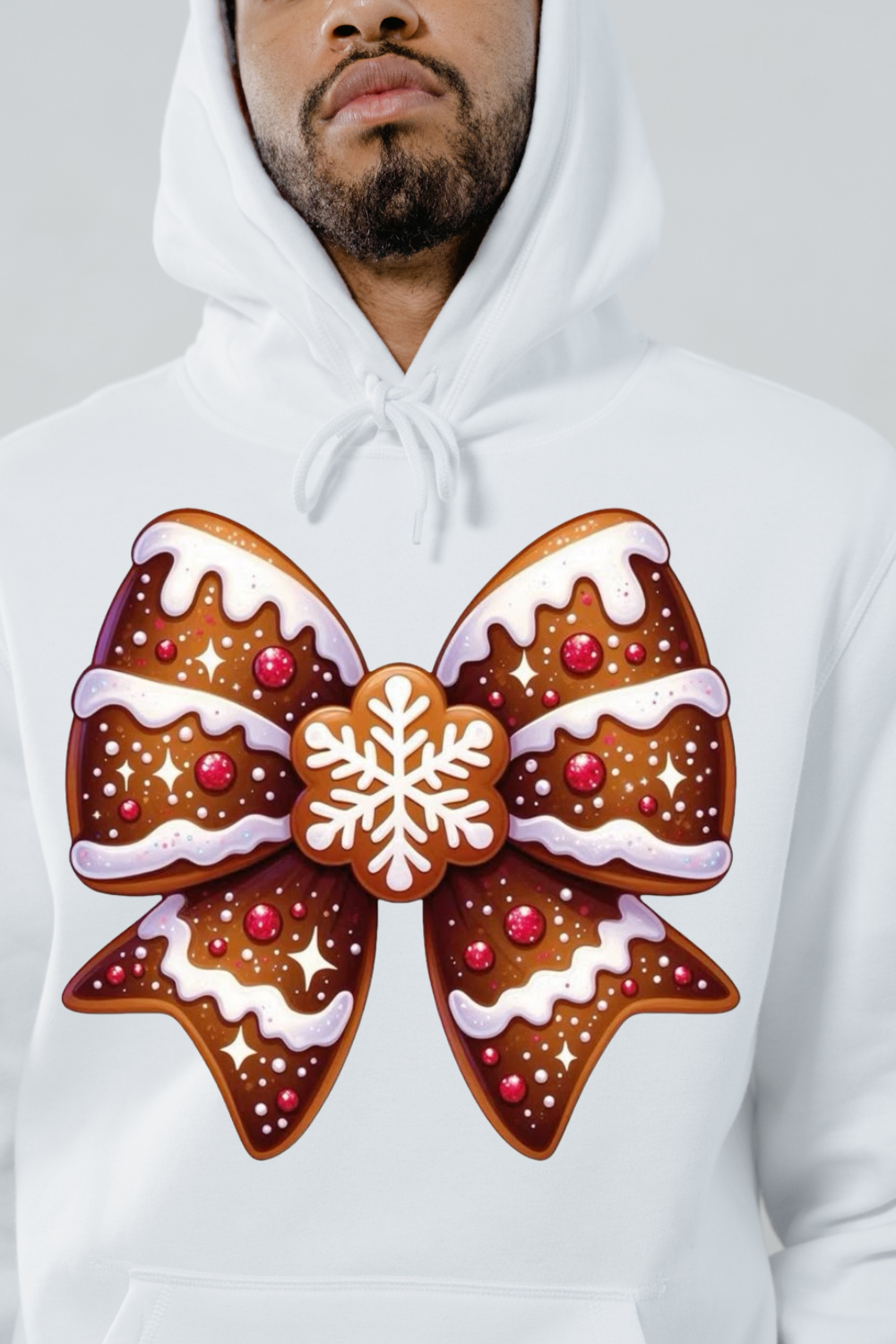 White hoodie with large gingerbread bow hoodie design featuring icing and a snowflake center