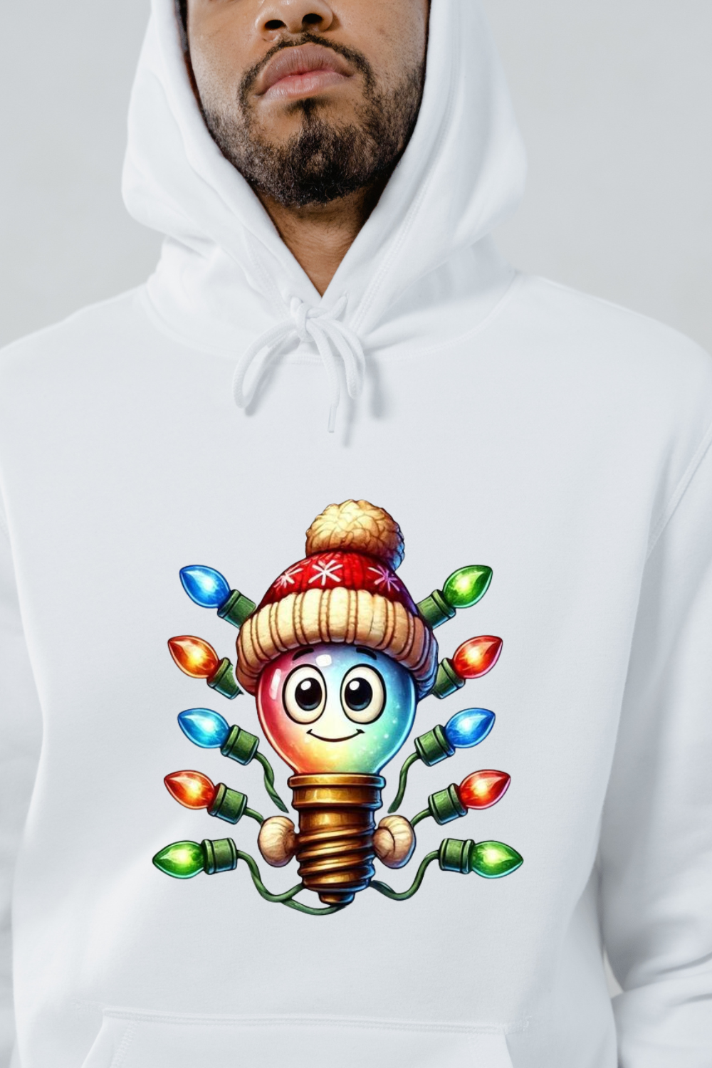 White hoodie with a colorful cartoon light bulb wearing a winter hat surrounded by Christmas lights