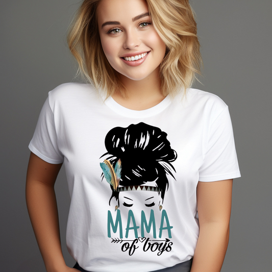 Smiling woman wearing a white Mama of boys shirt with a graphic of a woman with a feather in her hair