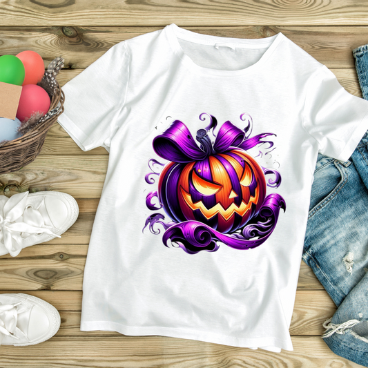White t-shirt featuring a custom Halloween pumpkin design with a purple bow and swirling details