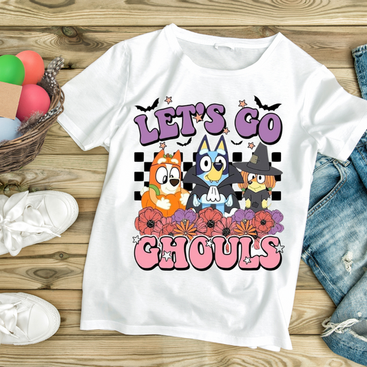 White t-shirt with colorful cartoon characters and text Let’s Go Ghouls featuring ghouls themed clothing design